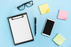 Business desk office with Goal, plan and action sticky notes on color background, Top view with copy space photo