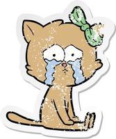 distressed sticker of a cartoon cat vector