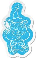 happy cartoon distressed sticker of a pig wearing santa hat vector