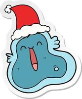 sticker cartoon of a germ wearing santa hat vector