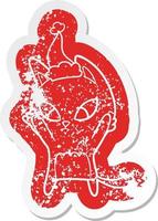 confused cartoon distressed sticker of a cat wearing santa hat vector