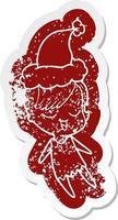 happy cartoon distressed sticker of a girl wearing santa hat vector