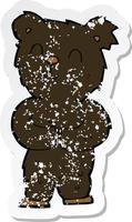 retro distressed sticker of a cartoon happy little black bear vector