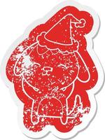 happy cartoon distressed sticker of a dog wearing santa hat vector