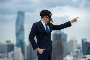 portrait of businessman wearing gas pollution protection face mask and suit, concept of danger toxic safety for human and chemical environment problem man about hazard business photo