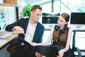 professional business person team are meeting and brainstorming in modern corporate office, discussion group and working with businessman colleague teamwork by using laptop for digital communication photo