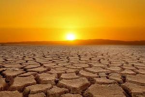 Global warming, drought, lack of rain, no seasonality The land is cracked. concept of environment change and global warming photo