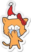 sticker cartoon of a cat wearing santa hat vector