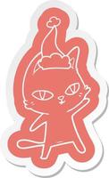 pegatina de dibujos animados de un gato mirando con sombrero de santa vector
