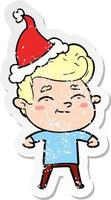 happy distressed sticker cartoon of a man wearing santa hat vector