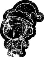 cartoon distressed icon of a astronaut man wearing santa hat vector