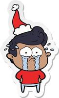sticker cartoon of a crying man wearing santa hat vector