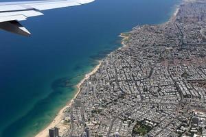 The earth is visible through the window of an airplane photo