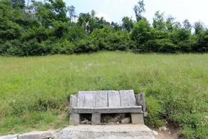 Bench for rest in a city park on the shores of the Mediterranean Sea. photo