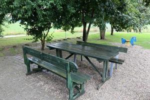 Bench for rest in a city park on the shores of the Mediterranean Sea. photo