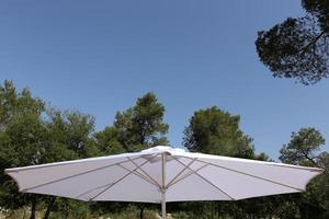 Umbrella to protect the sun in a city park in Israel photo