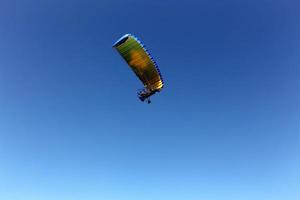 A paraglider flies over the Mediterranean Sea in northern Israel photo