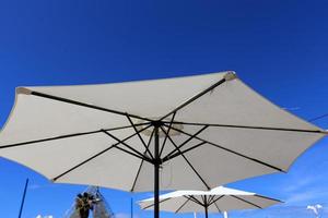 Umbrella to protect the sun in a city park in Israel photo