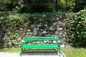 Bench for rest in a city park on the shores of the Mediterranean Sea. photo