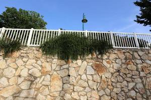 Fence in a city park on the Mediterranean Sea in Israel photo