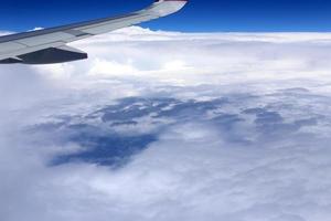 The earth is visible through the window of an airplane photo