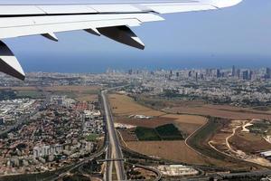 The earth is visible through the window of an airplane photo