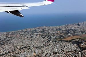 The earth is visible through the window of an airplane photo