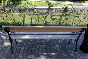 Bench for rest in a city park on the shores of the Mediterranean Sea. photo