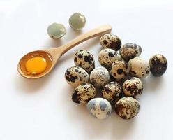 Group of quail eggs on white background photo