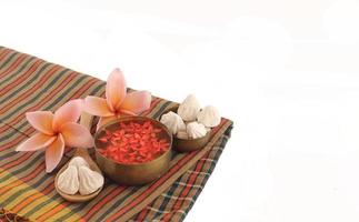 Thai fabric and bowl of water on songkran day isolated on white background photo