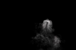 Abstract powder or smoke isolated on black background photo