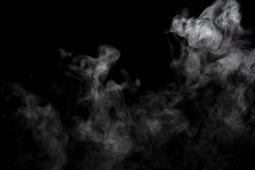 Abstract powder or smoke isolated on black background photo
