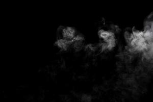 Abstract powder or smoke isolated on black background photo