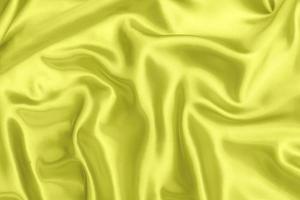 Yellow satin fabric texture soft blur background photo