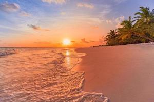 Fantastic closeup view of calm sea water waves with orange sunrise sunset sunlight. Tropical island beach landscape, exotic shore coast. Summer vacation, holiday amazing nature scenic. Relax paradise photo
