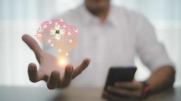 Light bulb with brain inside the hands of the businessman. The concept of the business idea. photo