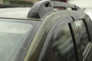 Car with roof rack in rain. photo