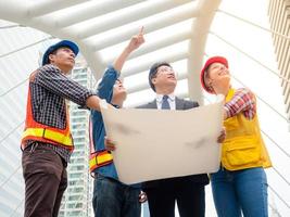 Group of engineer and businessman meeting and discussion their project work photo