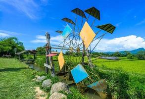 Water turbine make a water flow to fill an oxygen and put the water flow into the rice field photo