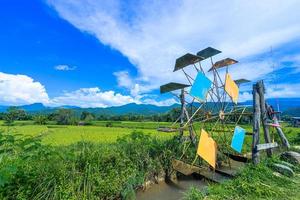 Water turbine make a water flow to fill an oxygen and put the water flow into the rice field photo