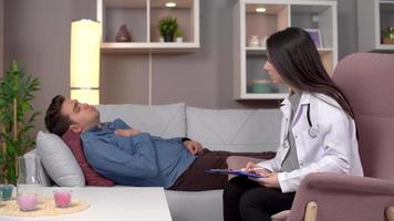 Home health, doctor patient relationship. Doctor treating patient at home. video