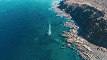 A fishing boat cruising through the sea.  Aerial video. Fishing boat in the sea. video