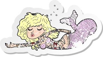 retro distressed sticker of a cartoon mermaid covered in tattoos vector