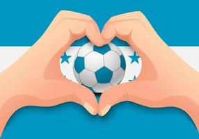 Balón de fútbol de Honduras y forma de corazón de mano vector