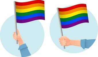 icono de la bandera lgbt en la mano vector