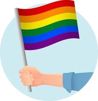 bandera lgbt en la mano vector