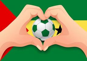 balón de fútbol de santo tomé y príncipe y forma de corazón de mano vector