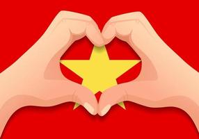 bandera de vietnam y forma de corazón de mano vector