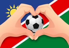 balón de fútbol de namibia y forma de corazón de mano vector