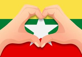 bandera de myanmar y forma de corazón de mano vector